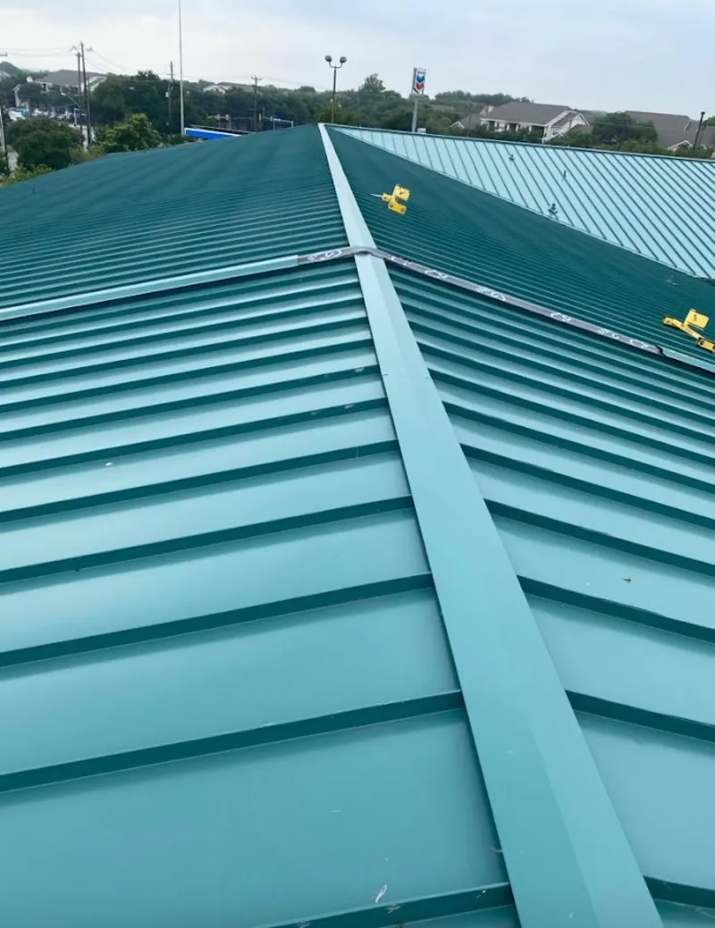 Green commercial metal roof ridge and valley for Metal Roof Repair in Spring Lake
